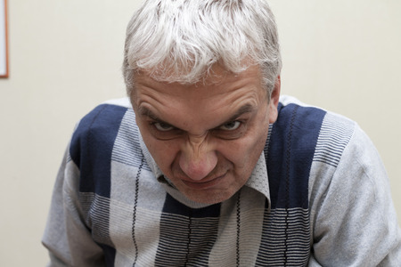 Different human emotions are represented on a face of the elderly personの写真素材