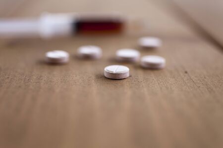 Pills on a table lie waiting for intake by the personの写真素材