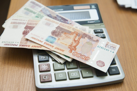 Calculation of money for their further warehousing in the safeの写真素材