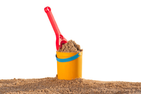 Bucket and shovel in the sand at the beachの写真素材