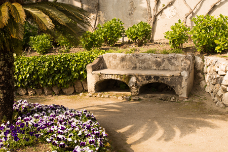 Relaxation place with bench in a flowering garden, Villa Rufolo, Ravello, Amalfi Coast, Italy, Solerno,Europeの写真素材