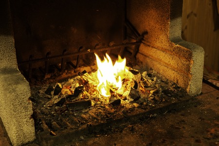 Empty flaming charcoal grill with open fire. Concept of summer grilling, barbecue, bbq and party. Black copyspaceの写真素材