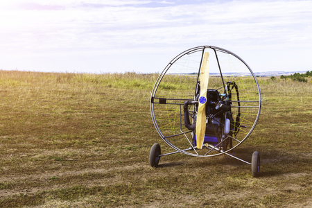 Closeup of moto paraglider on the field.の写真素材