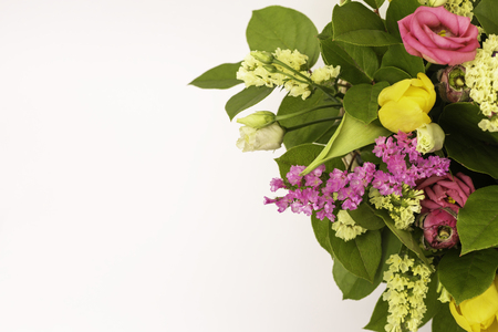 Closeup beautiful flowers in pastel colors on a blue background. Greeting card, Moms day, wedding invitation, birthday .Copy space.の写真素材