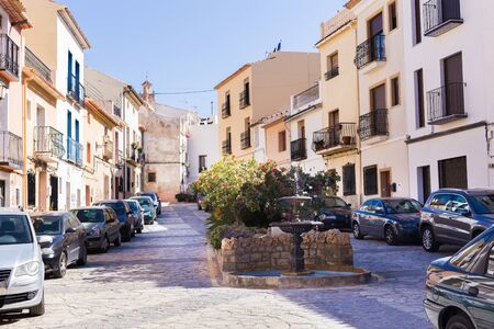 Finestrat, Alicante, Spain - February 23, 2019: Cozy little square with a fountain in the old townのeditorial素材