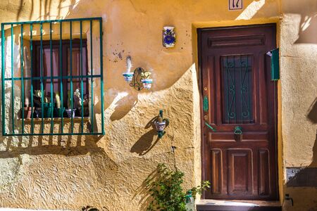 Finestrat, Alicante, Spain - February 23, 2019: Decor on the facade of a house with cracked plaster and in the old town of Fenistrat Spainのeditorial素材