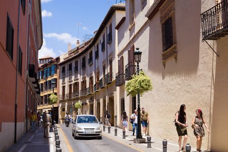 Granada, Andalucia, Spain- May 26, 2019: The narrow street with old houses architecture Granadaのeditorial素材