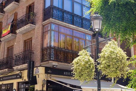 Granada, Andalucia, Spain- May 26, 2019: The narrow street with old houses architecture Granadaのeditorial素材