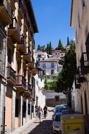 Granada, Andalucia, Spain- May 26, 2019: The narrow street with old houses architecture Granadaのeditorial素材