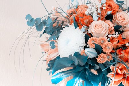 A bouquet of flowers with a stylish blue and amber tint. Fantastic bouquetの写真素材