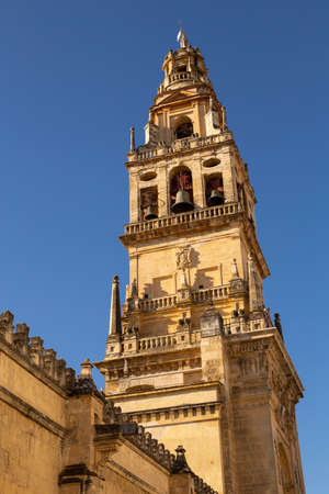 Bell tower of the Great Mosque, now a Catholic cathedral against the sky. Cordoba, Andalusia, Spain.の写真素材