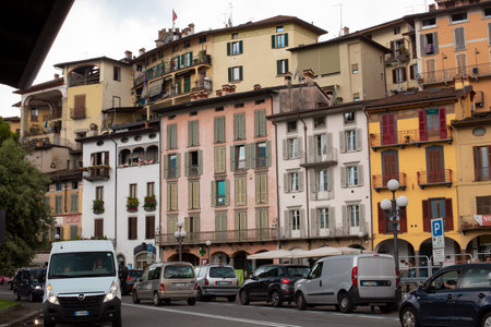 Lovere, Italy - June 28, 2017: Beautiful facades of houses in the old Italian town, houses with tiled roofsのeditorial素材