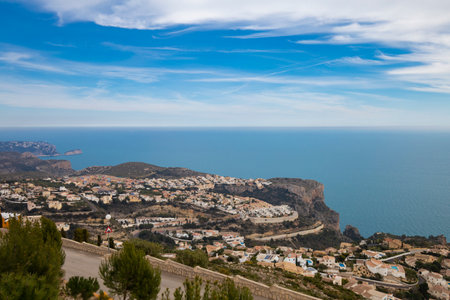 Panoramic view of Cumbre del Sol in Spain, villas on the hills and the sea.
