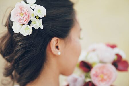 Wedding. The girl's hair. Flowers in hair. Wedding bouquet. A beautiful couple. High quality photoの写真素材