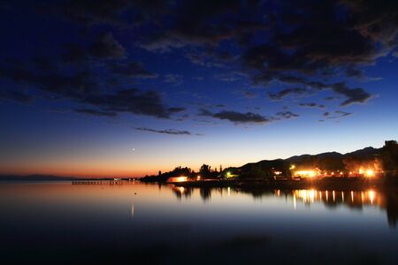 Clouds reflected on the water during sunset. High quality photo.の写真素材