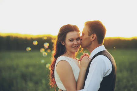 Happy bride and groom in the light of car headlights. Wedding. Happy love concept. High quality photoの写真素材