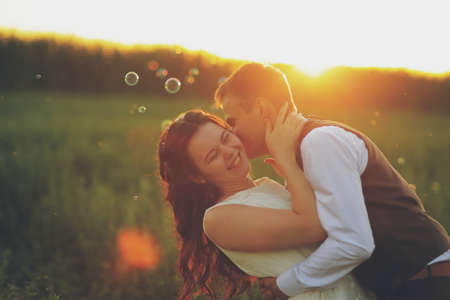 Happy bride and groom in the light of car headlights. Wedding. Happy love concept. High quality photoの写真素材