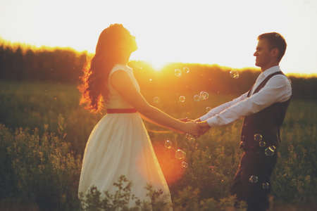 Happy bride and groom in the light of car headlights. Wedding. Happy love concept. High quality photoの写真素材