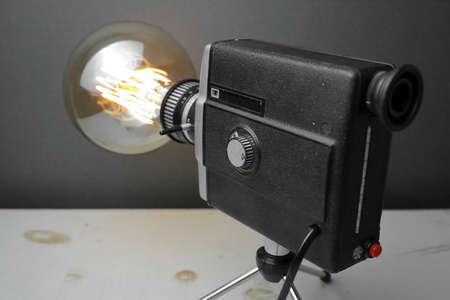 Retro lamp from an old camera with an Edison lamp on a gray background. Concept is a good idea. High quality photoの写真素材
