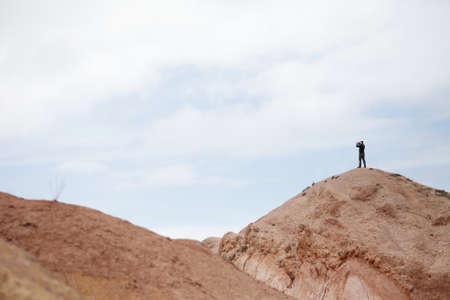 Man on the top of the mountain. Beautiful mountain landscape. Wildlife of Kyrgyzstan. Kyrgyzstan. High quality photoの写真素材