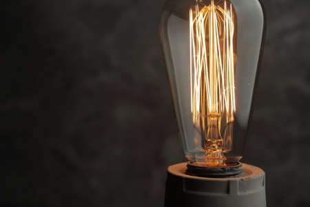 Retro lamp with Edison lamp on concrete. A good idea
