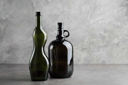 Wine bottle on a concrete background. Free space for inscription Fitness conceptの写真素材