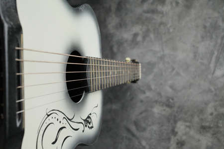 Vintage ladies antique guitar on a concrete baseの写真素材