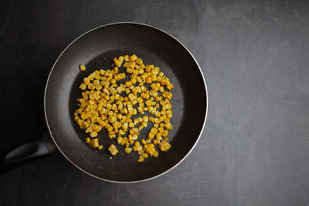 Diet. Organic Grilled Corn in a frying pan. Organic farm vegetables. Gray background Top view. Vegetarian food. Environmentally friendly productsの写真素材