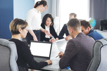Group of young business people meeting in the office having fun together discussing an ideaの写真素材