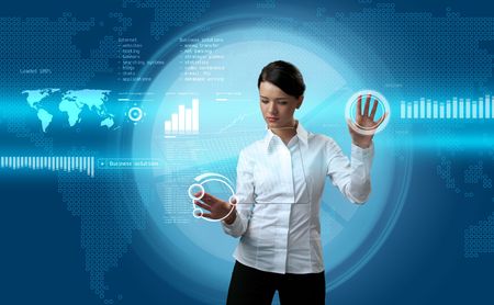 Attractive brunette navigating futuristic interface (outstanding business people in interiors / interfaces series)の写真素材