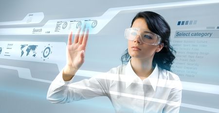 Pretty young lady using new technologies (outstanding business people in interiors / interfaces series)の写真素材