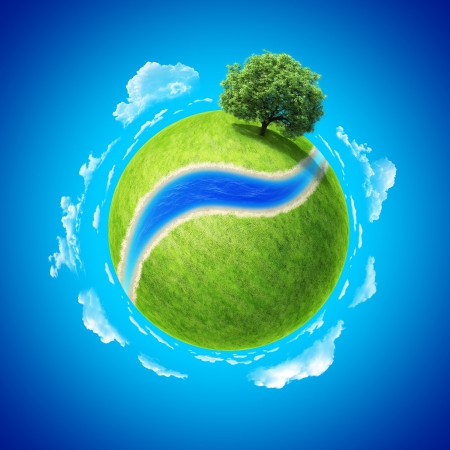 Mini planet concept  Empty space and river on fresh green field and sole standing dense tree  Place for your text, product or logo  Earth collection の写真素材