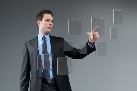 Businessman pushing button  Young man touching screen interface  Pressing technology  Future push interface collection の写真素材