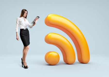 Wifi 3d icon  Businesswoman stand with tablet pc near Wireless network symbol の写真素材