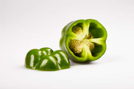 Sweet paprika pepper cut on white backgroundの写真素材