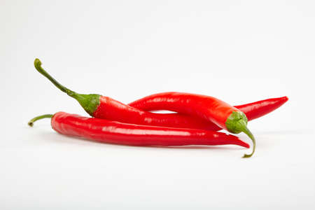 Red pepper chilli on a white backgroundの写真素材
