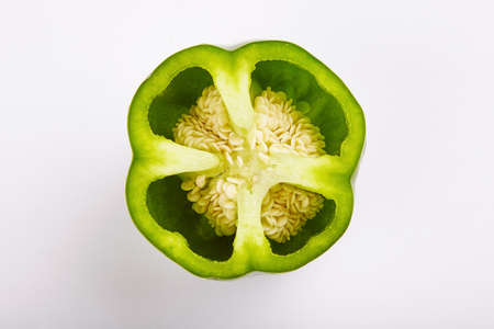 Sweet paprika pepper cut on white backgroundの写真素材