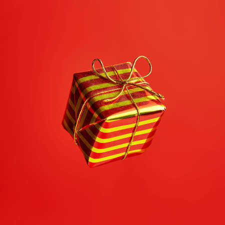 New year gift for greeting card on the red backgroundの写真素材