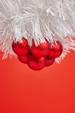 Christmas red toys for greeting card on the red backgroundの写真素材