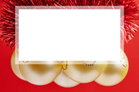 Christmas golden toys for greeting card on the red backgroundの写真素材