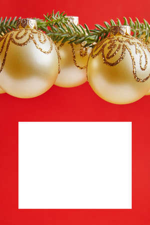 Christmas golden toys for greeting card on the red backgroundの写真素材