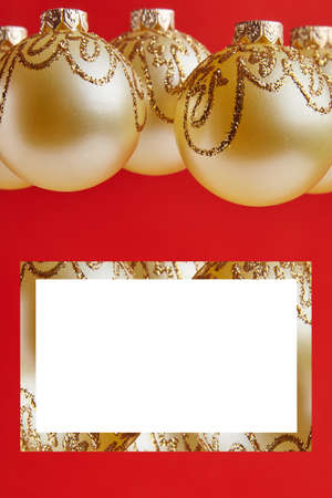 Christmas golden toys for greeting card on the red backgroundの写真素材