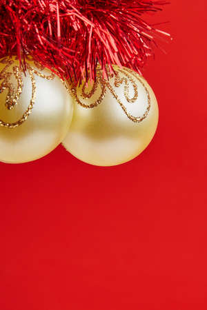 Christmas golden toys for greeting card on the red backgroundの写真素材