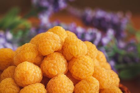 Close up of yellow raspberry on lavander backgroundの写真素材