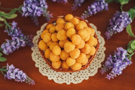 Yellow raspberry in the small basket with lavanderの写真素材