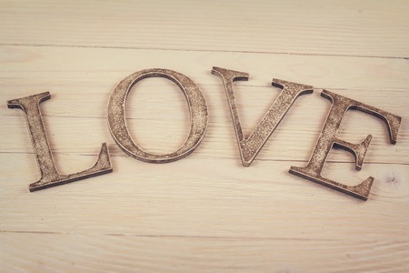 Wooden word Love decoration on light backgroundの写真素材
