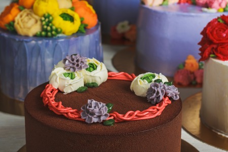 Chocolate cake with cream decorationの写真素材
