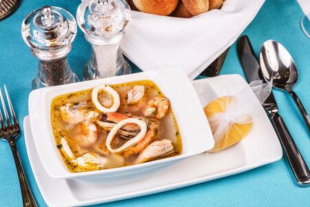 Squid, shrimp, chicken and crab meat soupの写真素材