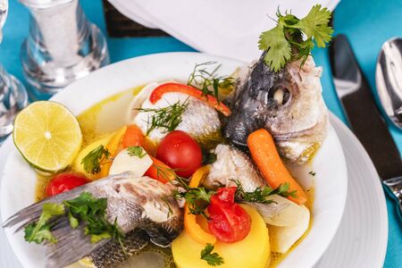Mediterranean fish soup with vegetables and limeの写真素材