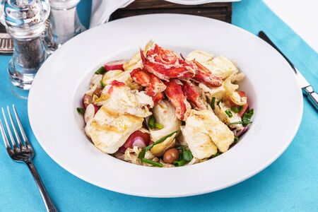 Mediterranean dish made from crab meat, chicken and fresh vegetablesの写真素材